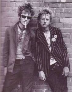 Two males - Punk Fashion - Ties, chains, ripped clothes, jackets and chains - classic Punk fashion